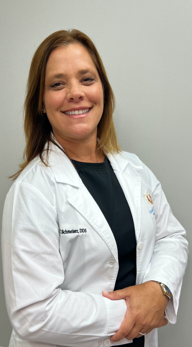 Dr. Sharon Schmeiser and the Kendall Breeze Dental team welcoming patients