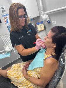 Happy patient receiving care at Kendall Breeze Dental Centers